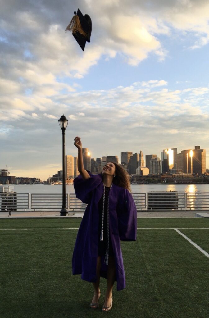 Jada, a Red Pine Scholars Program alumna, throwing her graduation cap in the air with joy. Photo provided by Jada. 